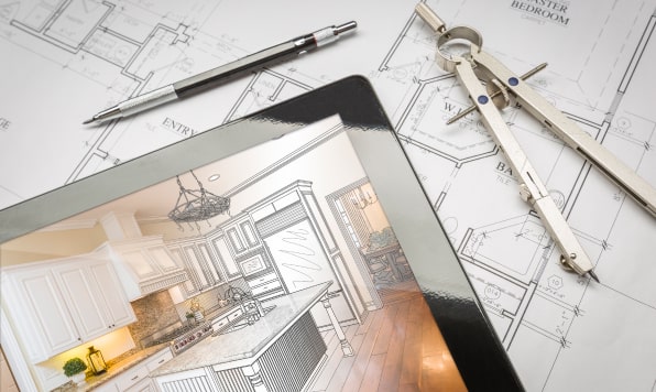 A kitchen renovation project opened on an iPad laying on top of the floor plan.